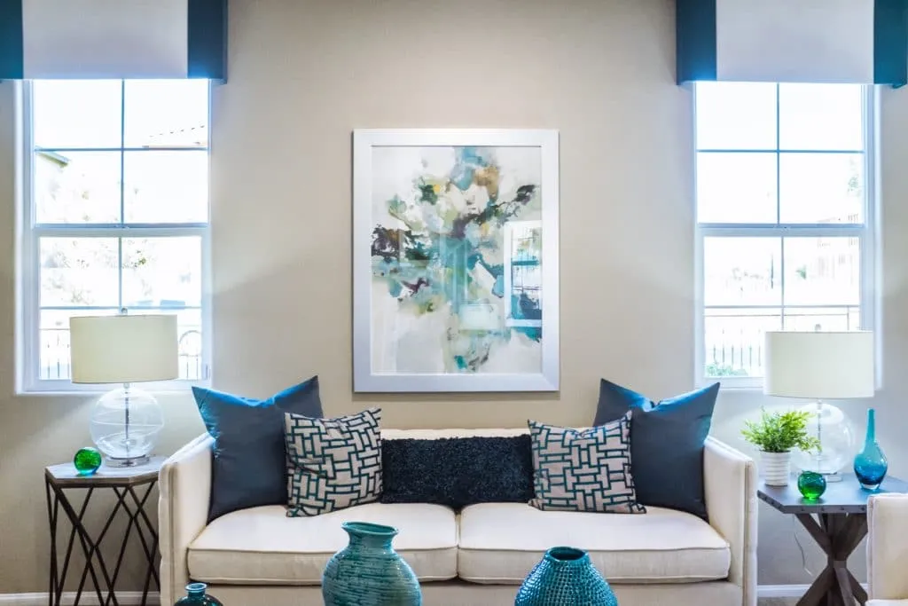 A family room furnished in white and blue tones.