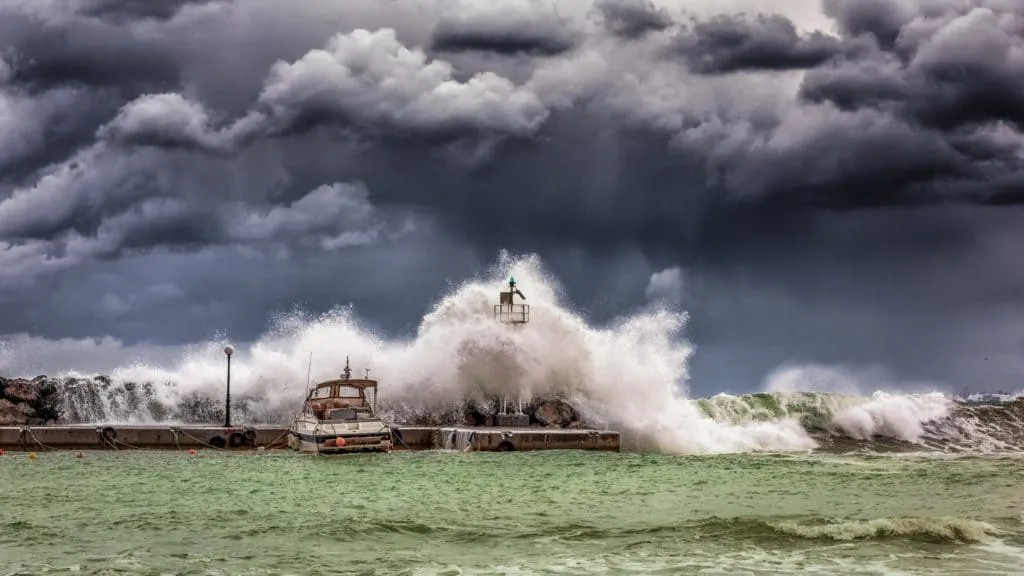 Dark storm clouds and big waves: Bad weather does happen in Paradise.